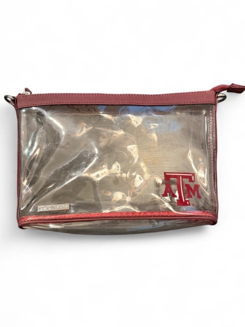 CAPRI DESIGNS Texas A&M clear game day bag with canvas trim and  'ATM' logo.